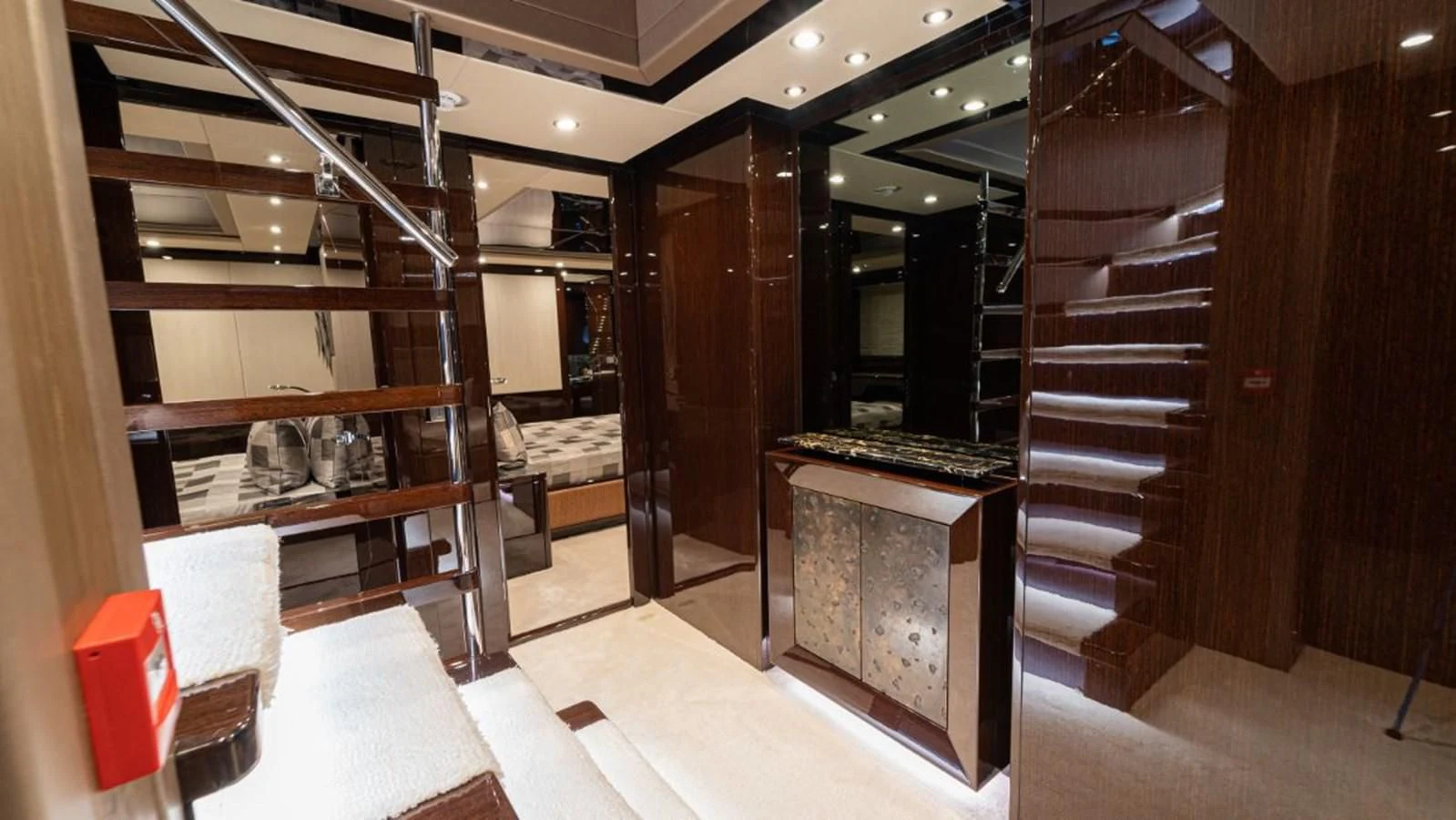a room with a bed and a desk with Robie House in the background aboard NEXUS Yacht for Charter