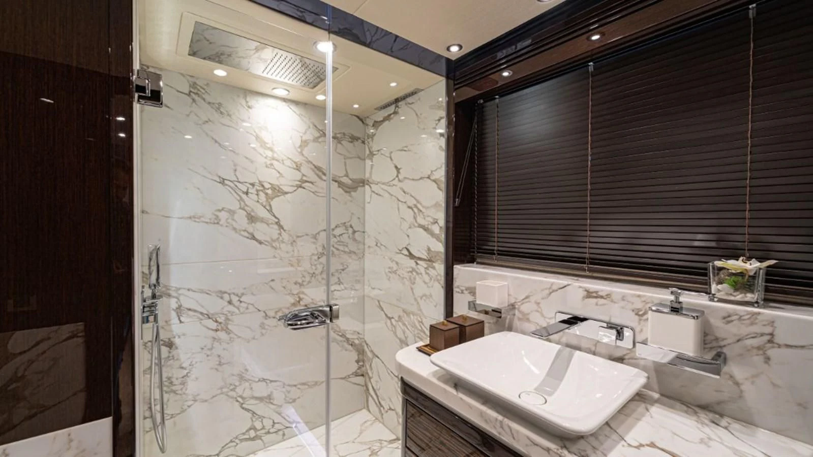 a bathroom with a shower and sink aboard NEXUS Yacht for Charter