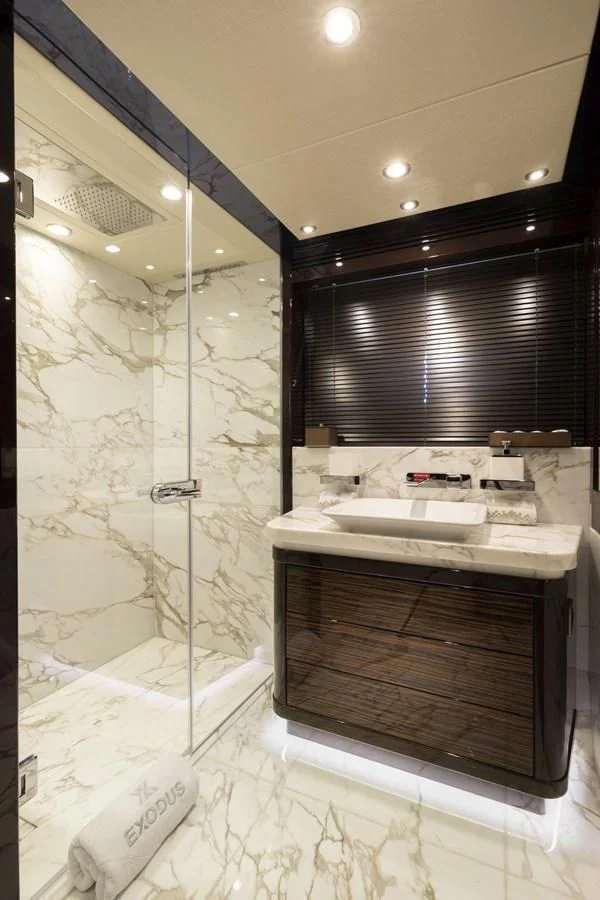 a bathroom with a glass shower aboard NEXUS Yacht for Charter