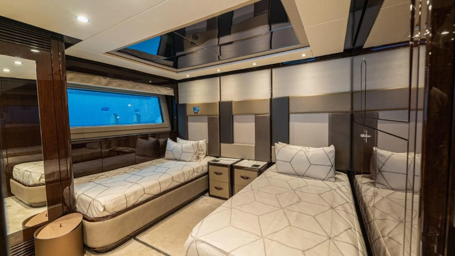 a room with a bed and a tv aboard NEXUS Yacht for Charter