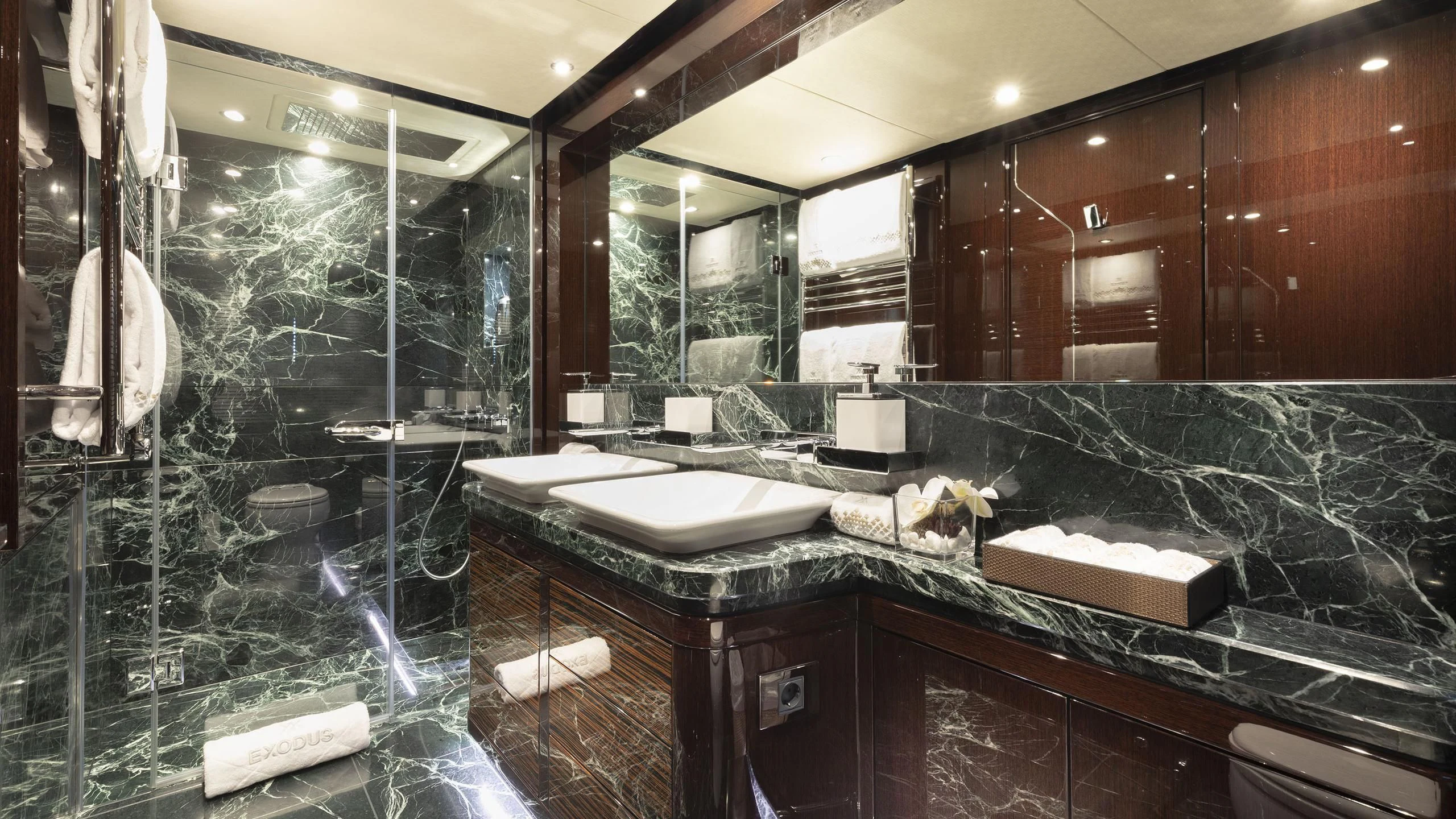 a bathroom with a large glass shower aboard NEXUS Yacht for Charter