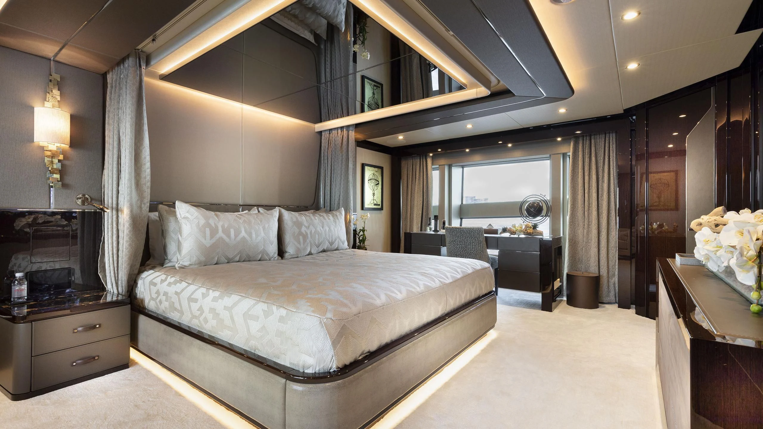 a large bedroom with a bed aboard NEXUS Yacht for Charter