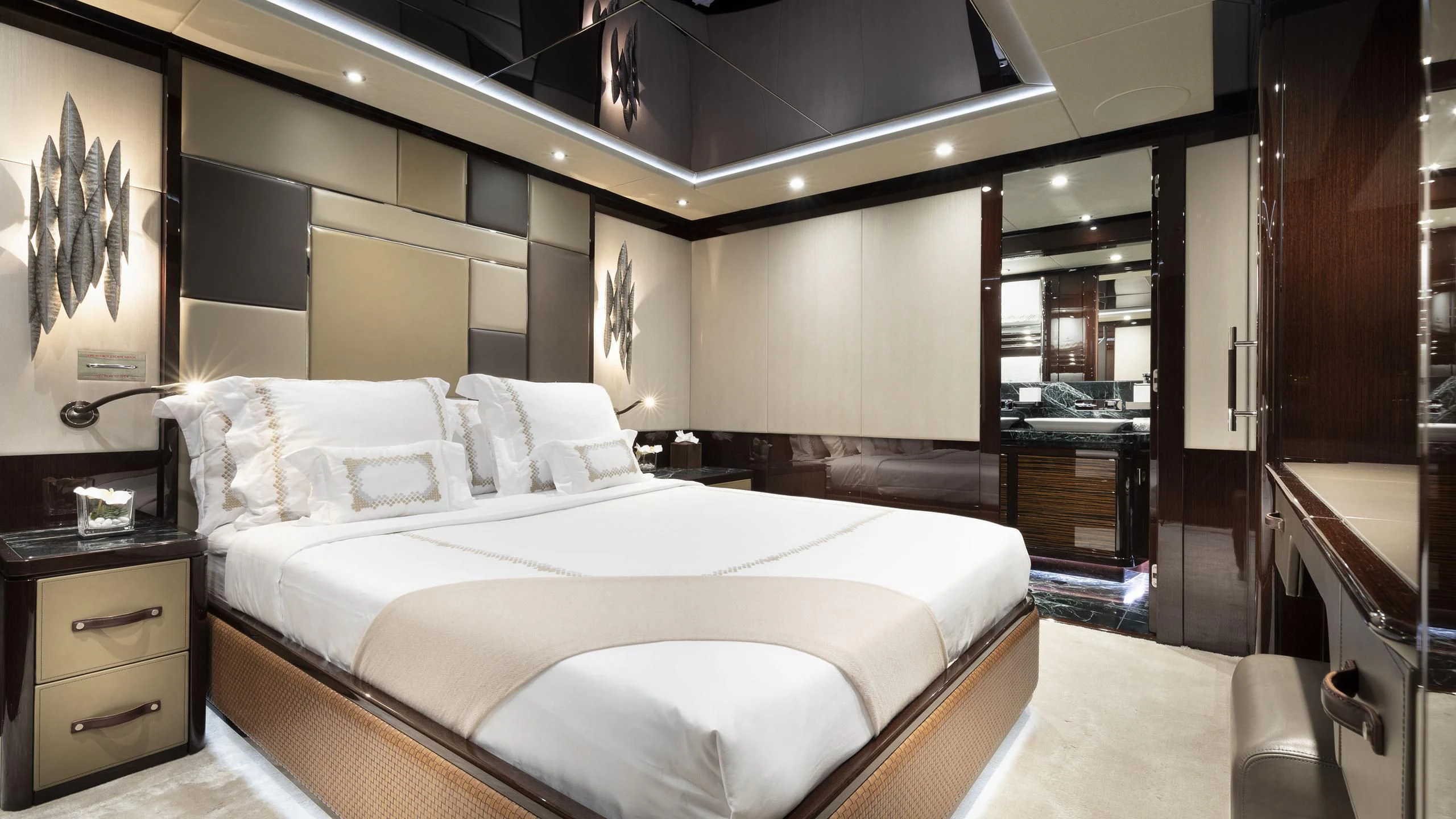 a large bedroom with a bed aboard NEXUS Yacht for Charter