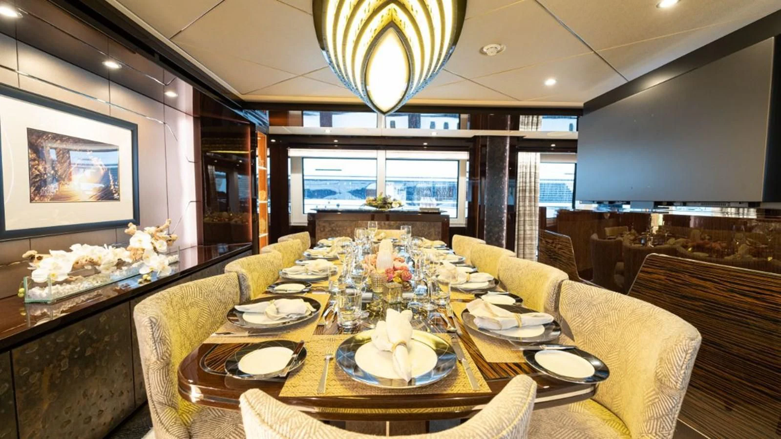 a dining room with a table set aboard NEXUS Yacht for Charter