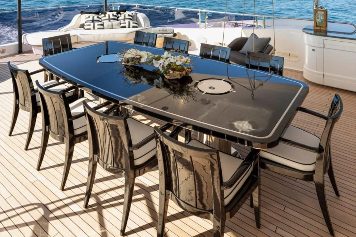 a table set for a dinner party aboard NEXUS Yacht for Charter