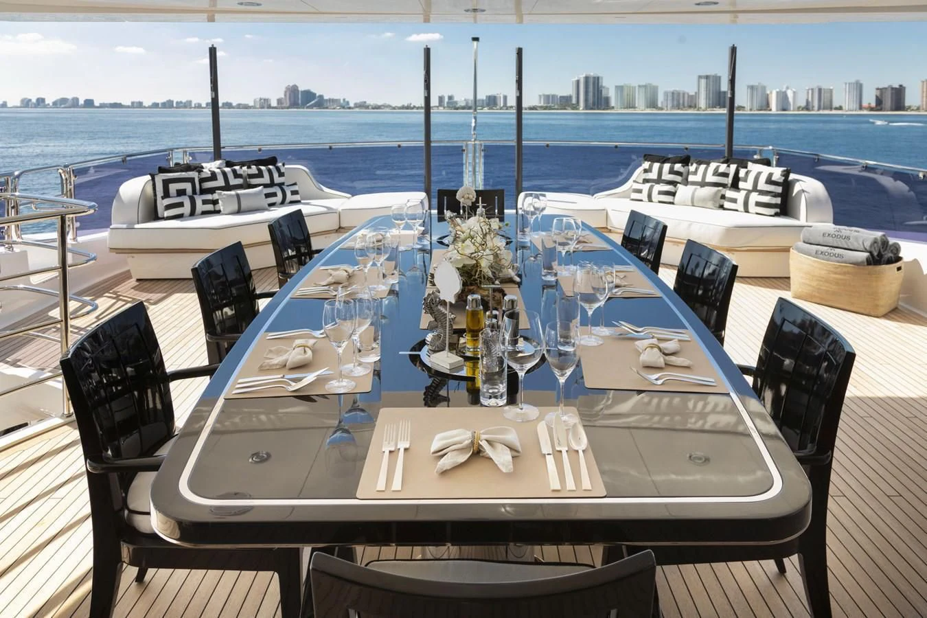 a table set for a dinner party aboard NEXUS Yacht for Charter