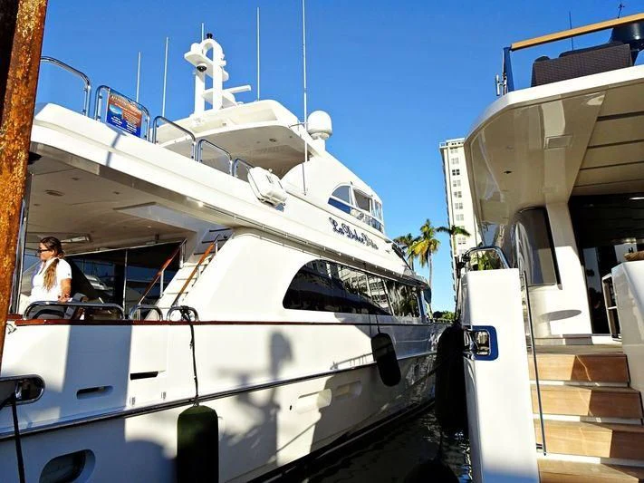 a white boat with a cross on the front aboard LA DOLCE VITA Yacht for Sale