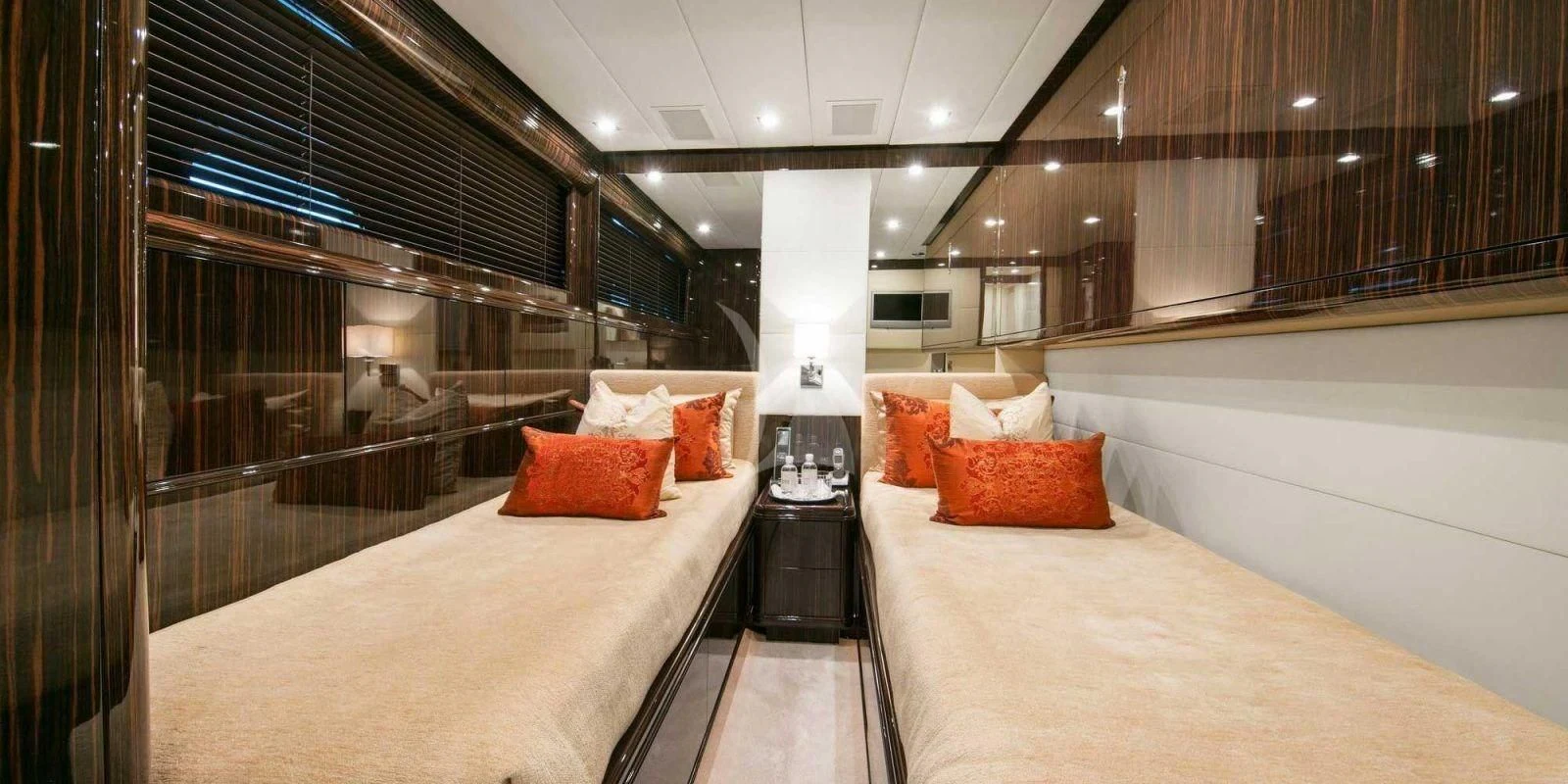 a room with a bed and a lamp aboard ATHOS Yacht for Sale