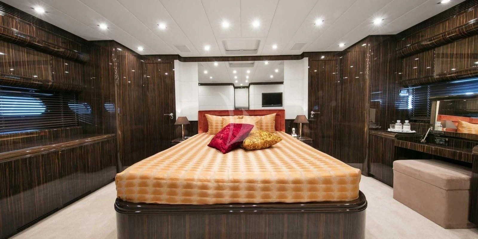 a large bed in a room aboard ATHOS Yacht for Sale