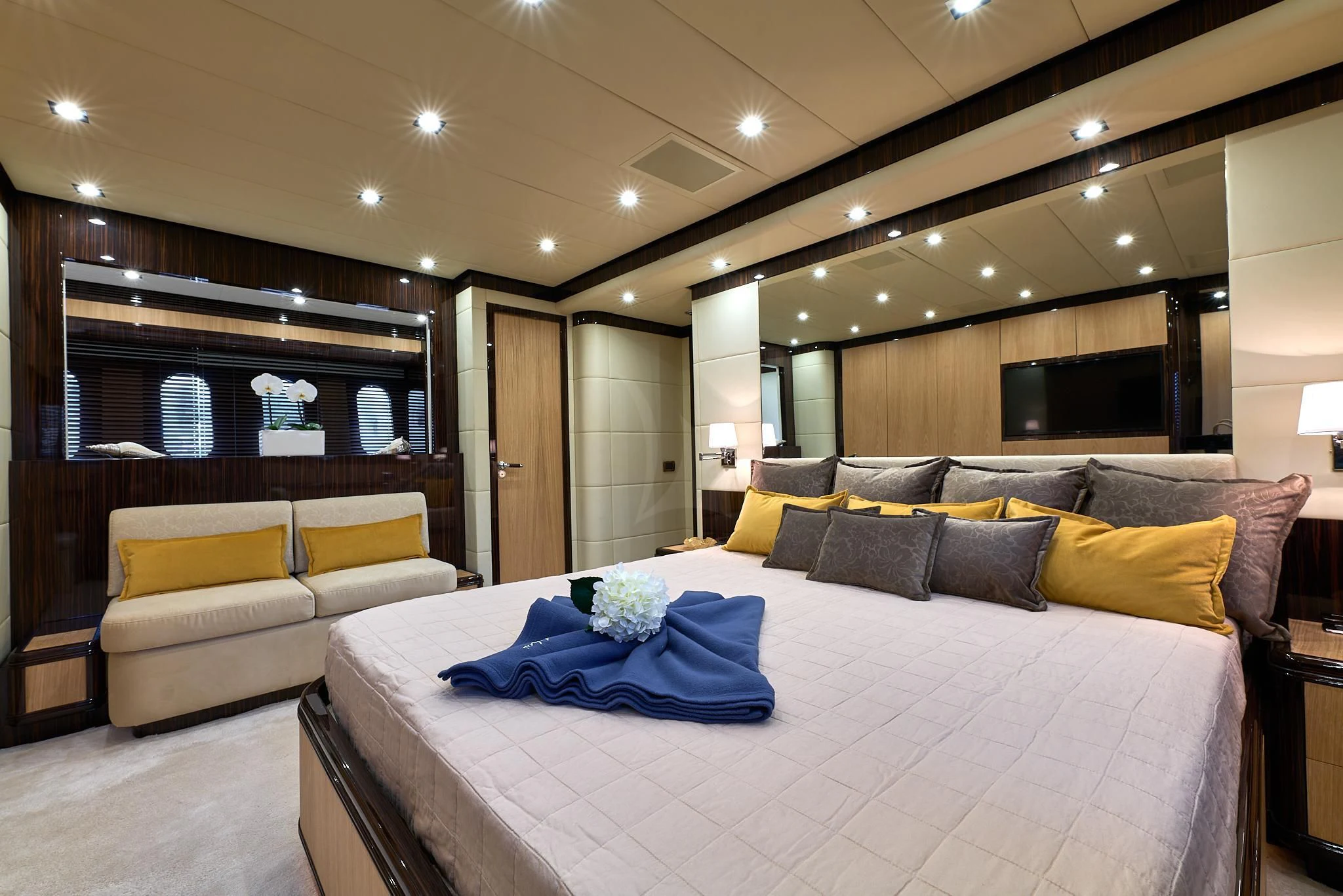 a large bed in a room aboard ATHOS Yacht for Sale