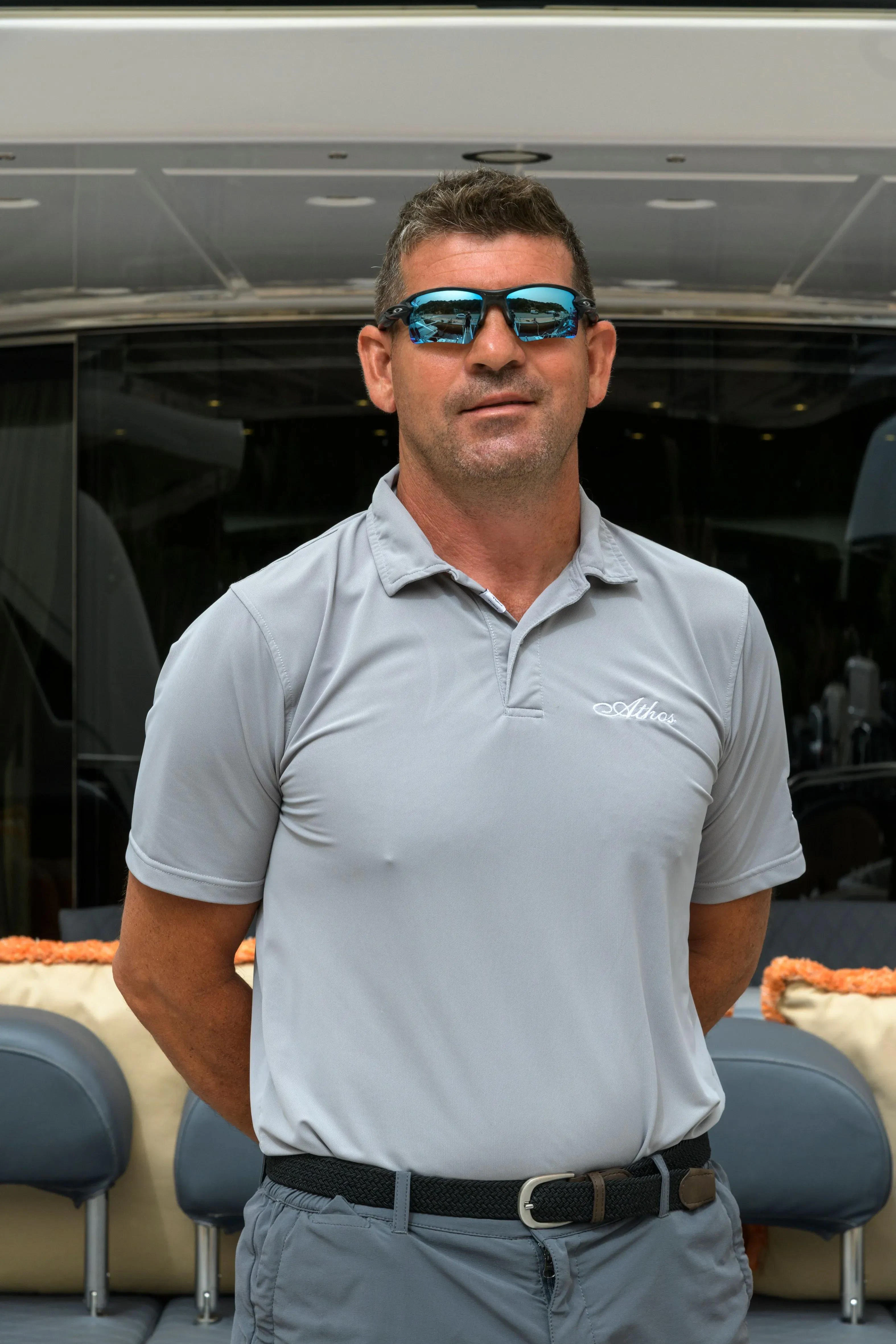 a man wearing sunglasses aboard ATHOS Yacht for Sale