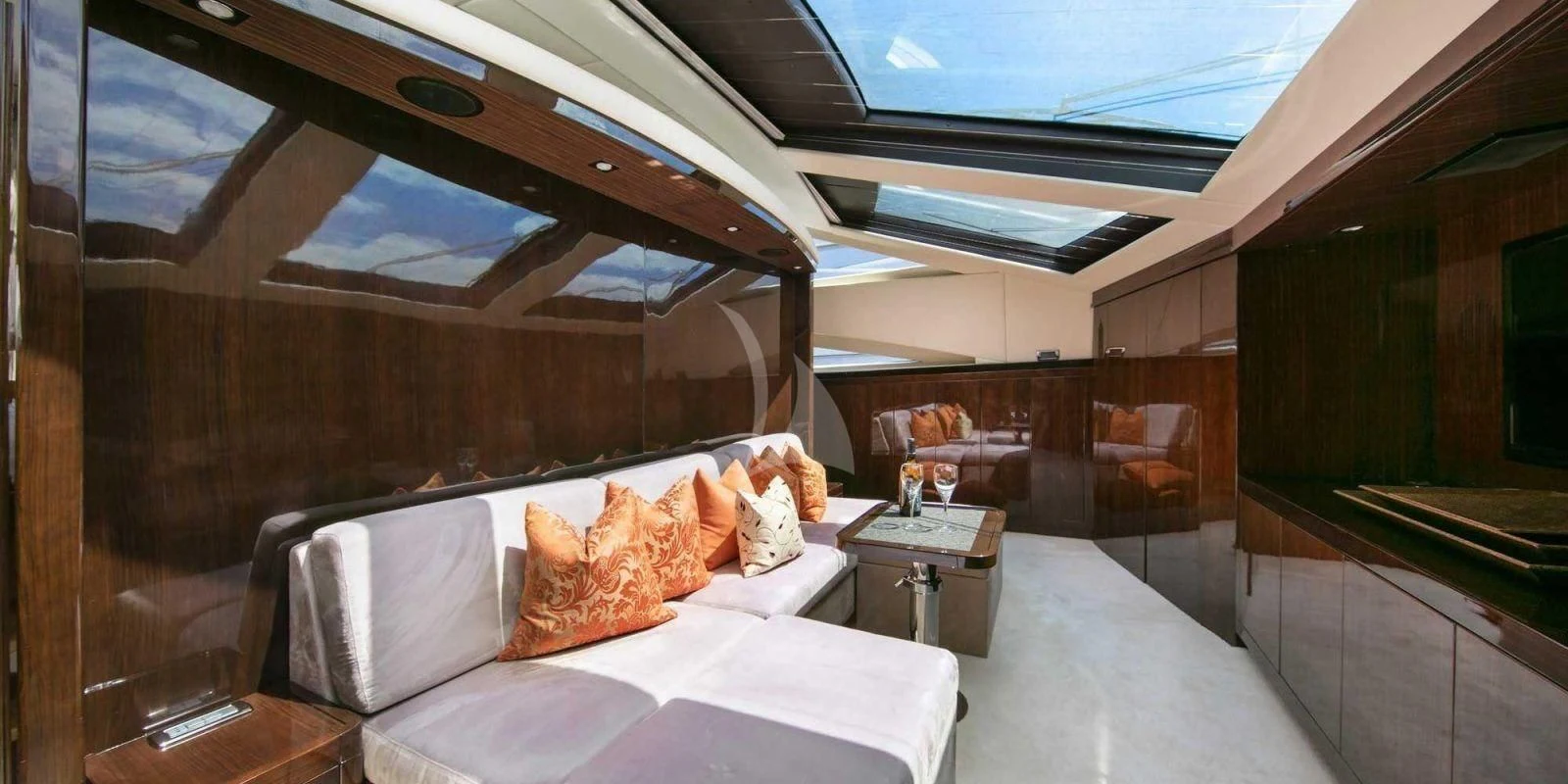 a room with a bed and a table aboard ATHOS Yacht for Sale