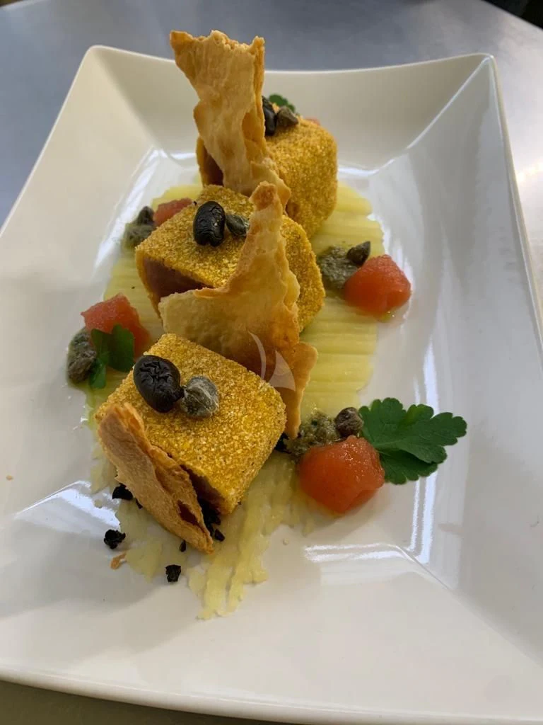 a plate of food aboard ATHOS Yacht for Sale