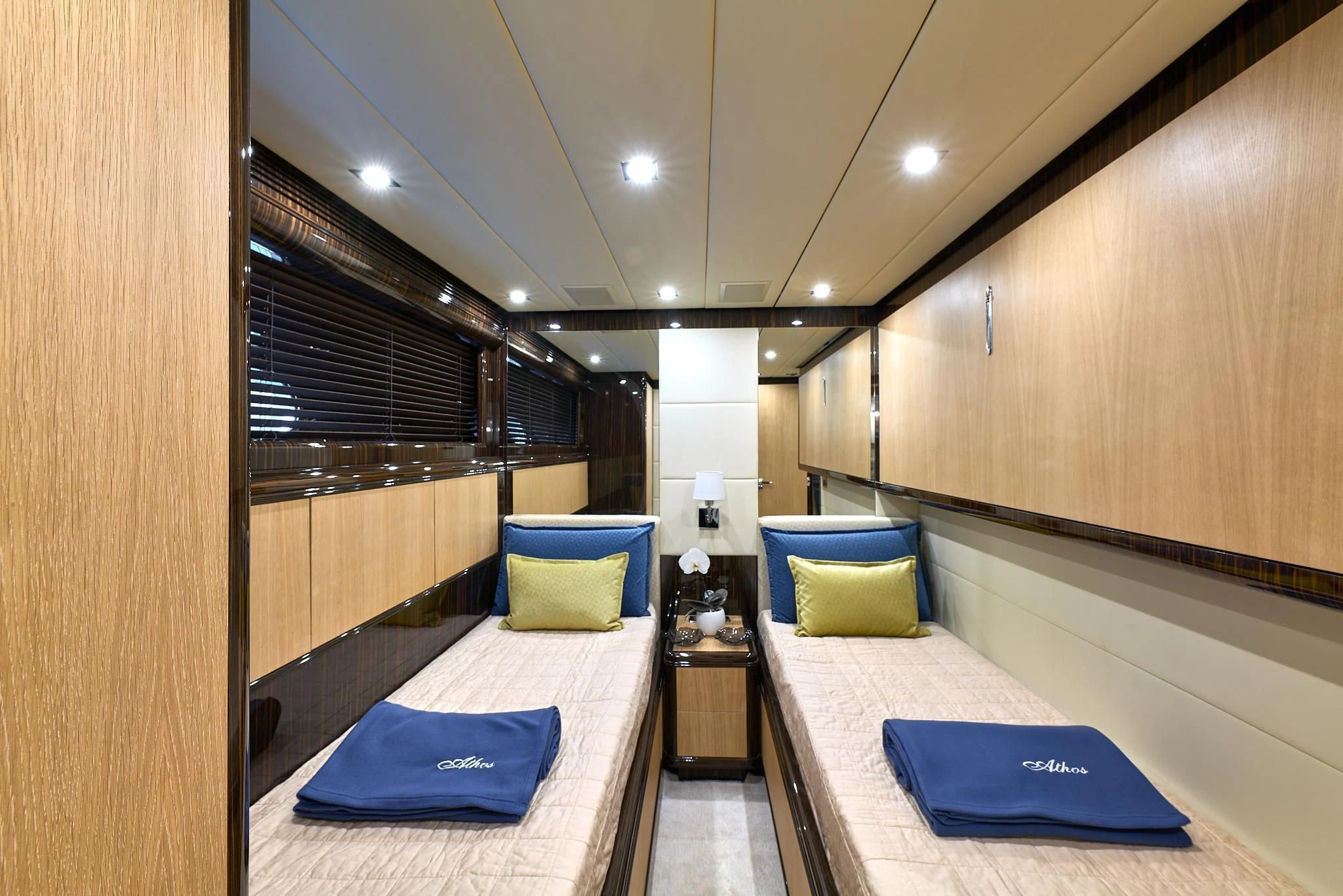 a room with a bed and a desk aboard ATHOS Yacht for Sale