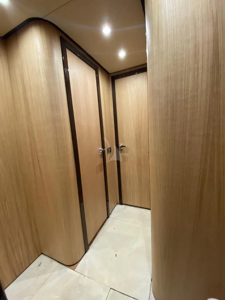 a room with a wood door aboard ATHOS Yacht for Sale