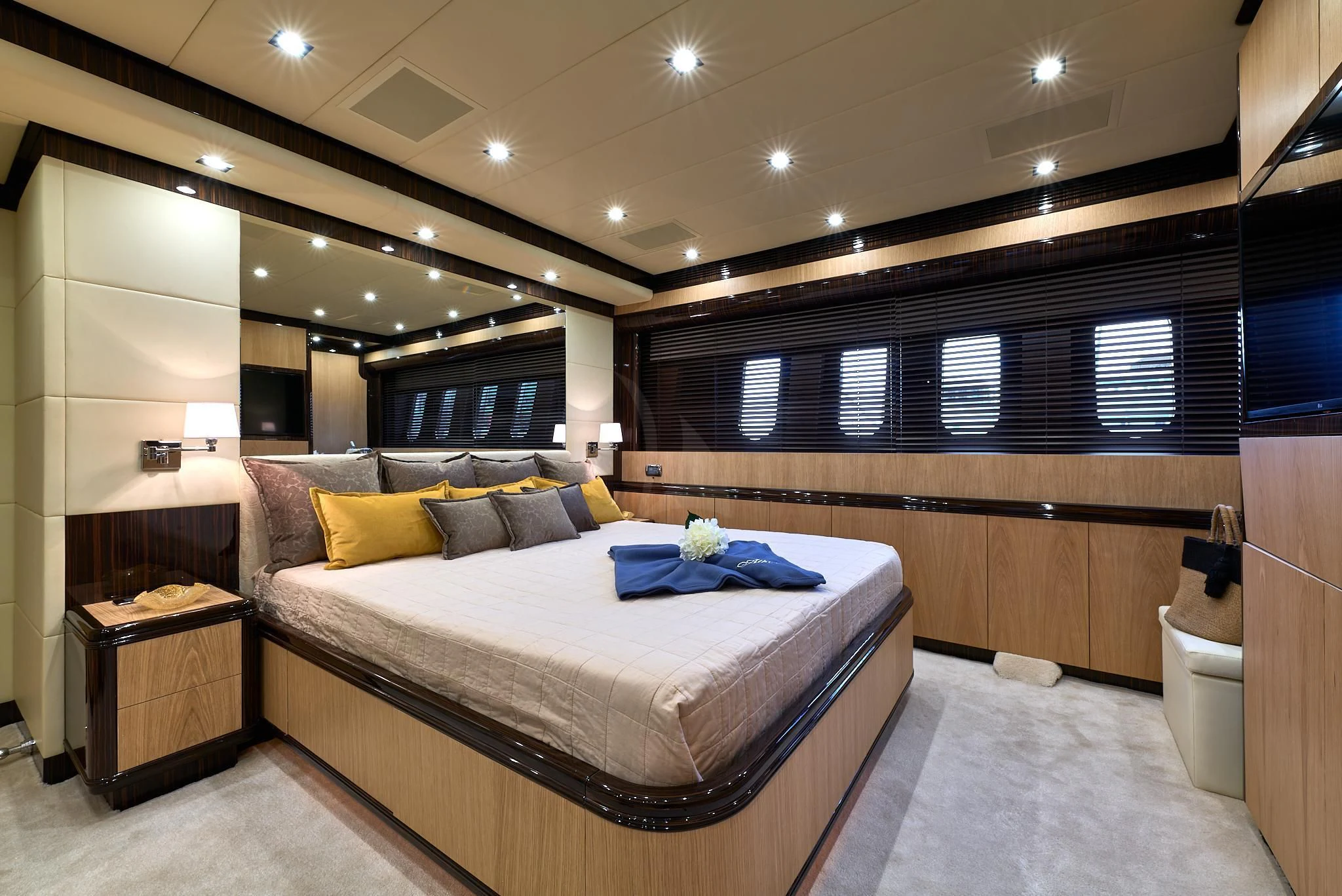 a room with a bed and a window aboard ATHOS Yacht for Sale