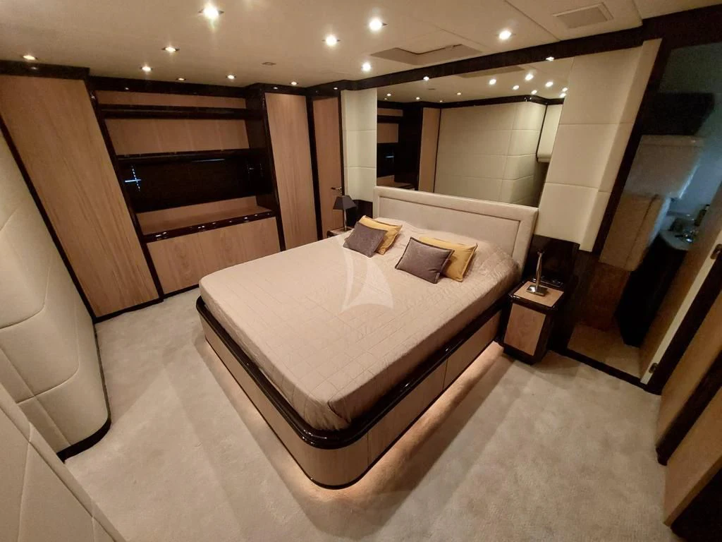 a large hotel room with a large bed aboard ATHOS Yacht for Sale