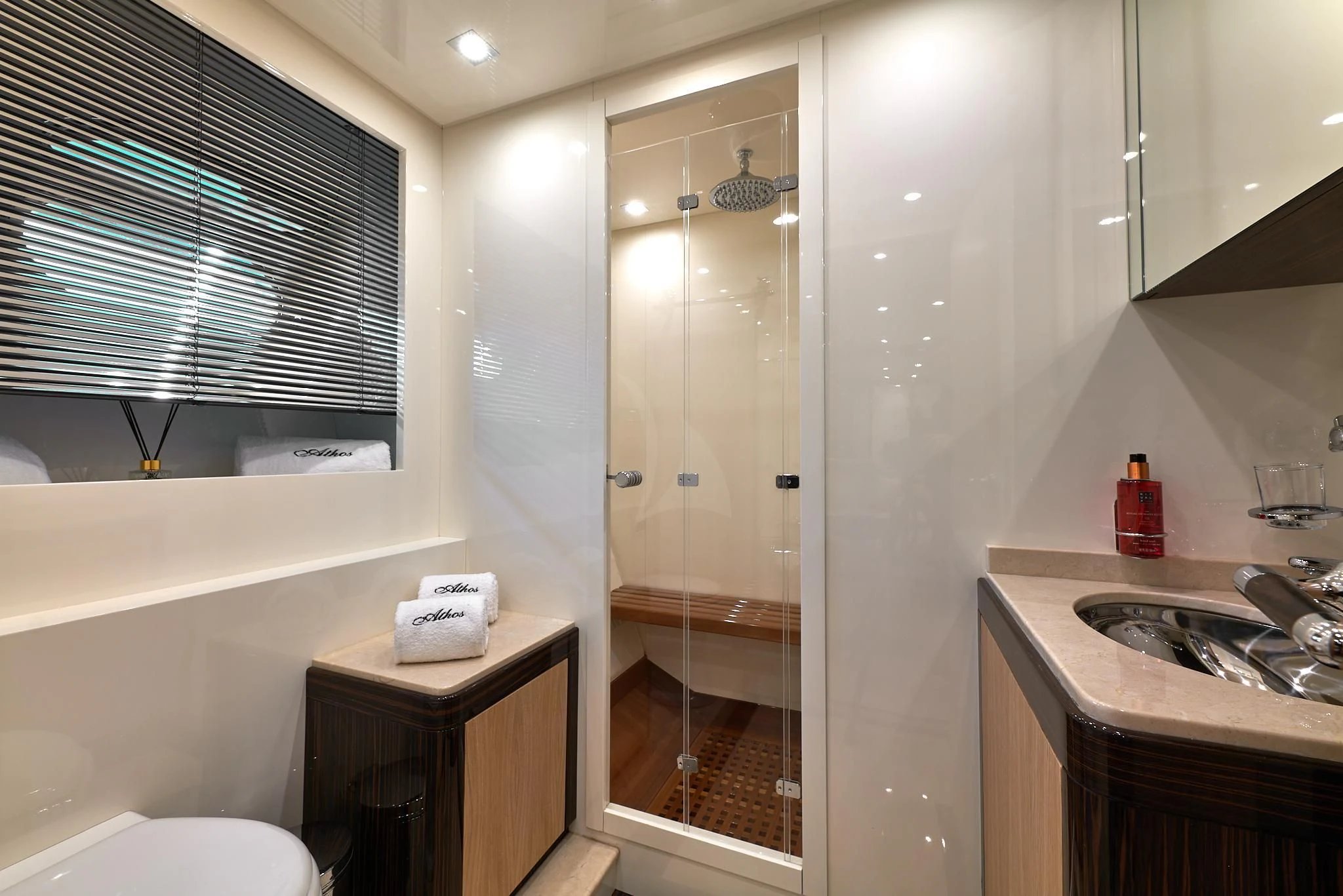 a bathroom with a glass shower aboard ATHOS Yacht for Sale