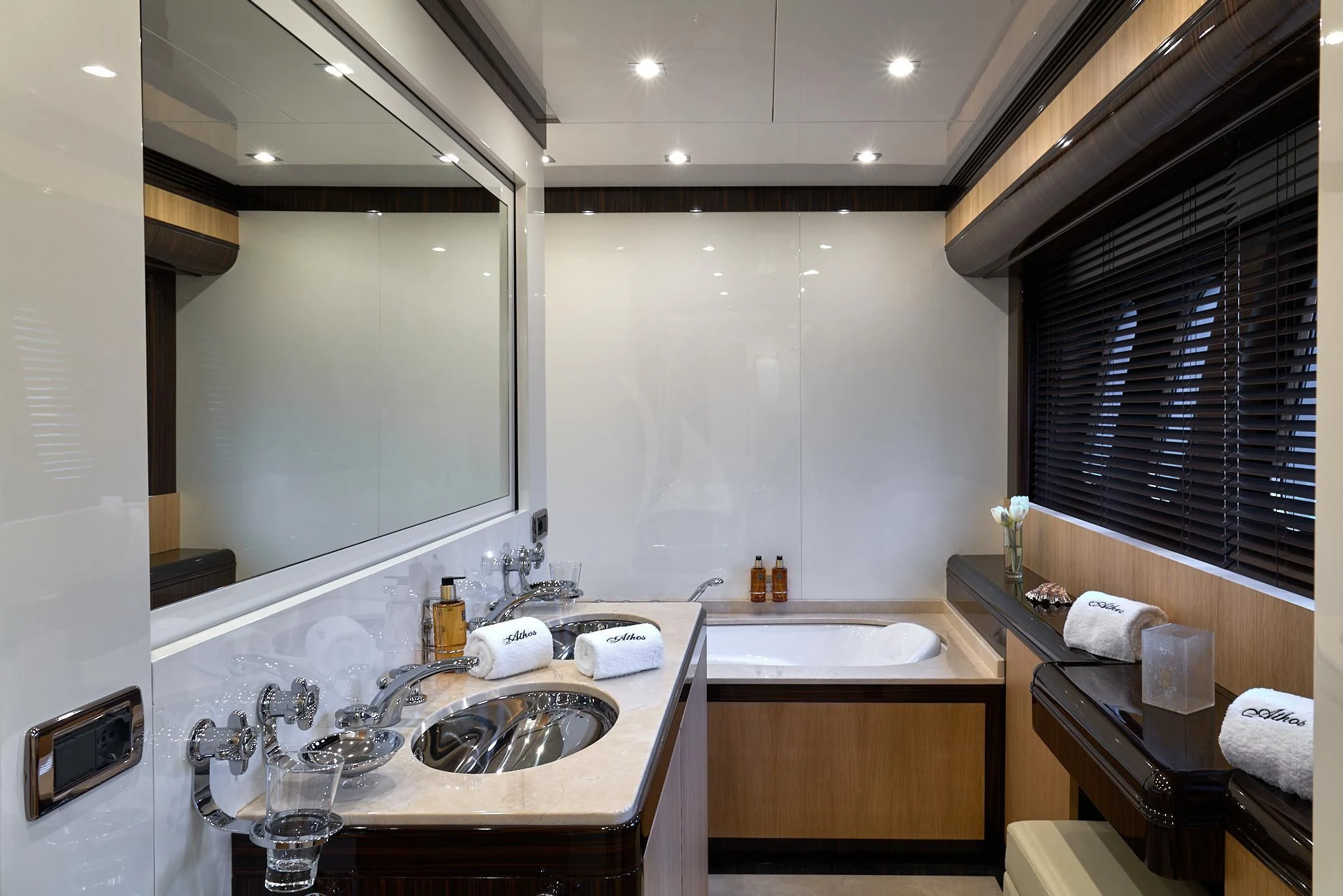 a bathroom with a sink and a mirror aboard ATHOS Yacht for Sale