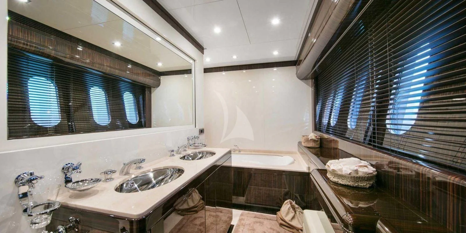 a bathroom with sinks and mirrors aboard ATHOS Yacht for Sale