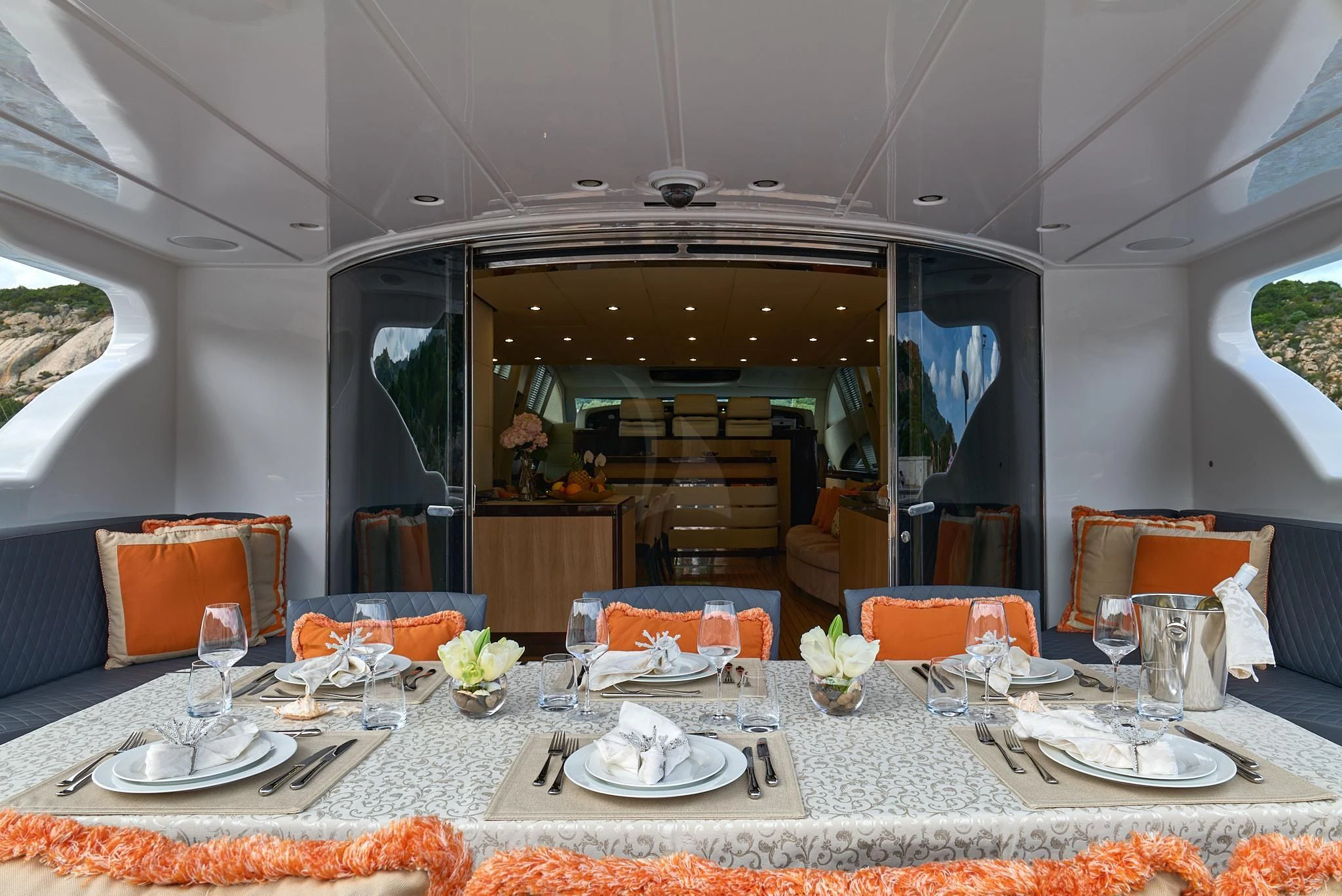 a table set with plates and glasses aboard ATHOS Yacht for Sale