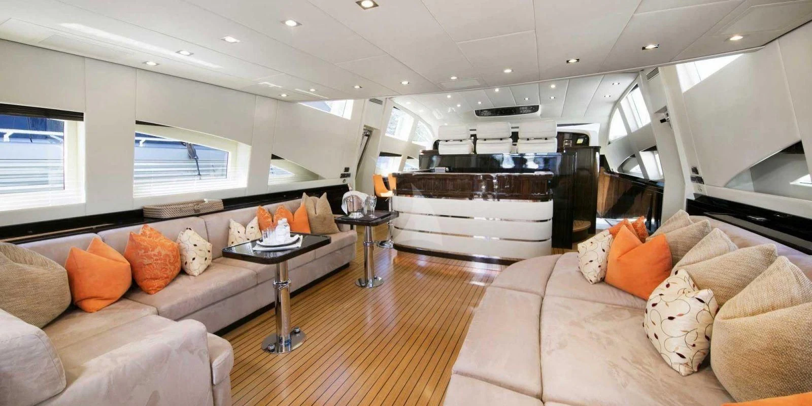 a living room with a large kitchen aboard ATHOS Yacht for Sale