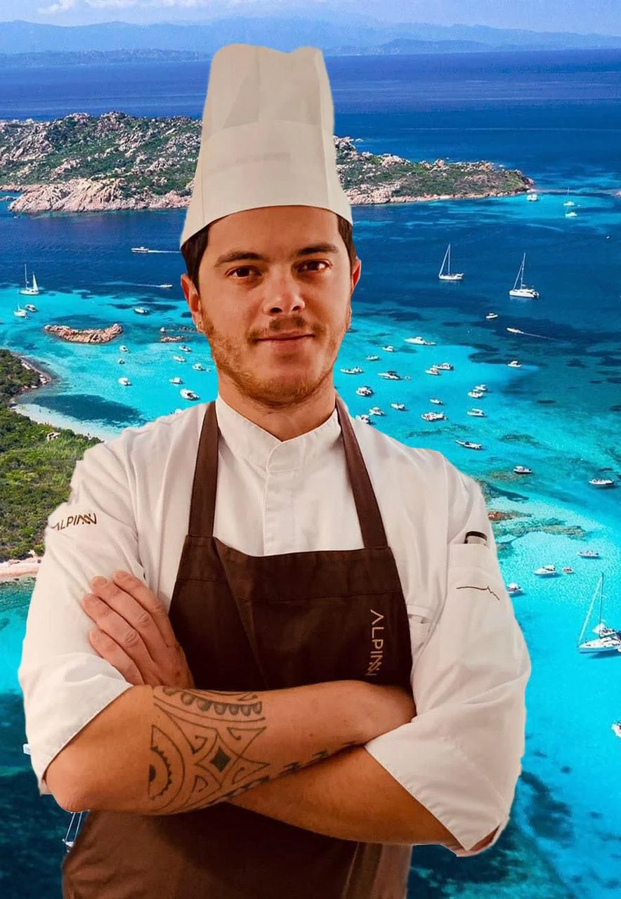 a man with a hat and a cape on a beach aboard ATHOS Yacht for Sale