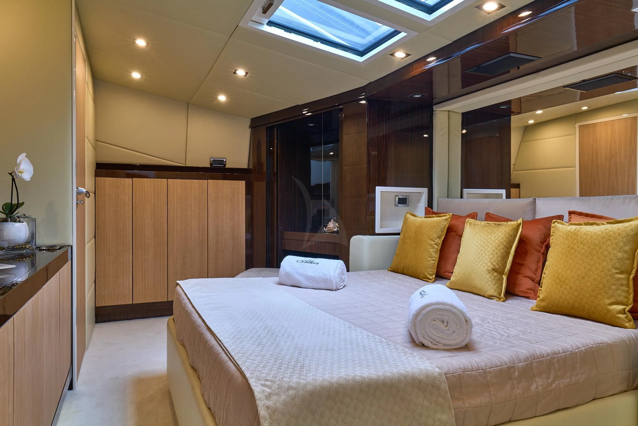 a large bed in a hotel room aboard ATHOS Yacht for Sale