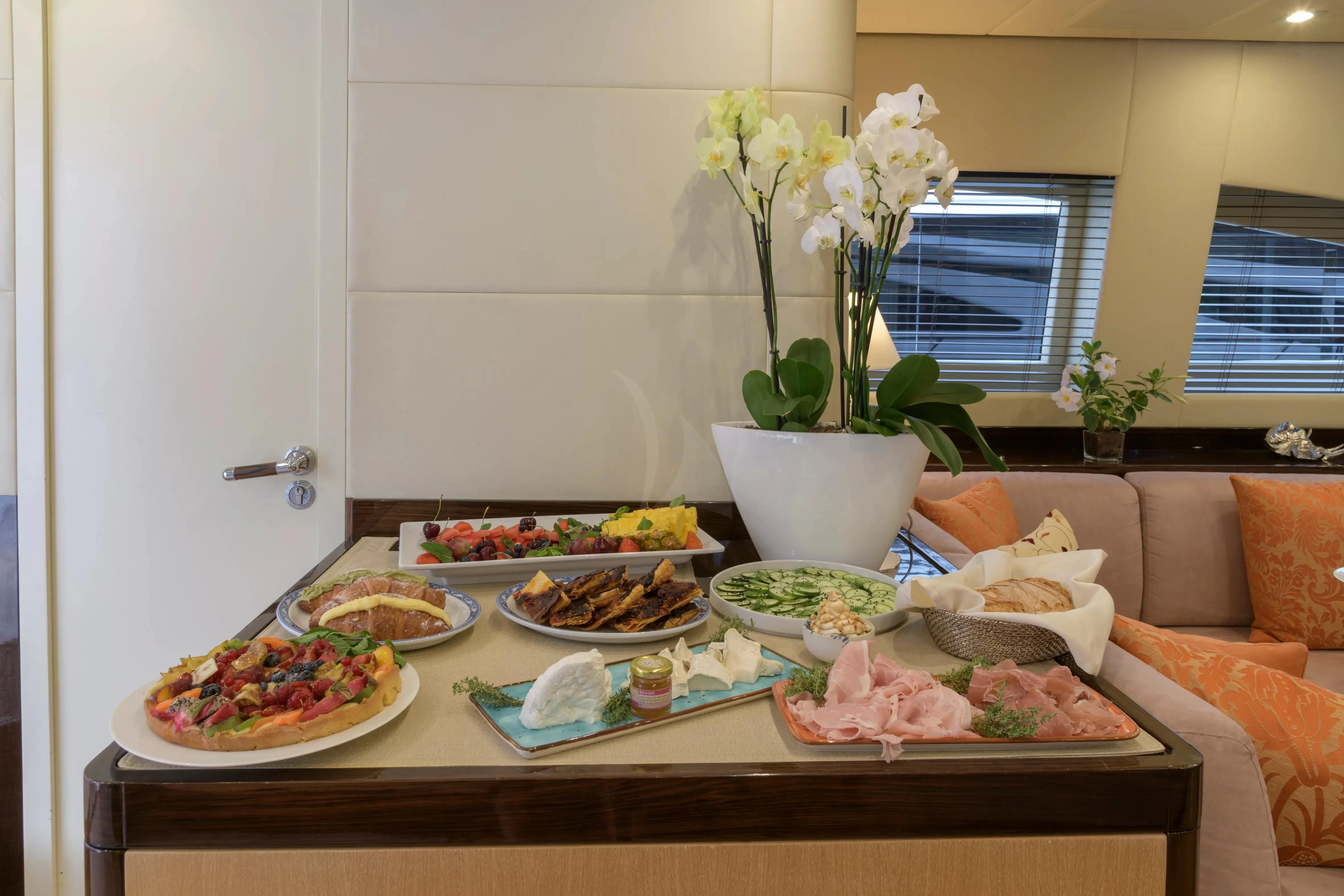 a table with food on it aboard ATHOS Yacht for Sale