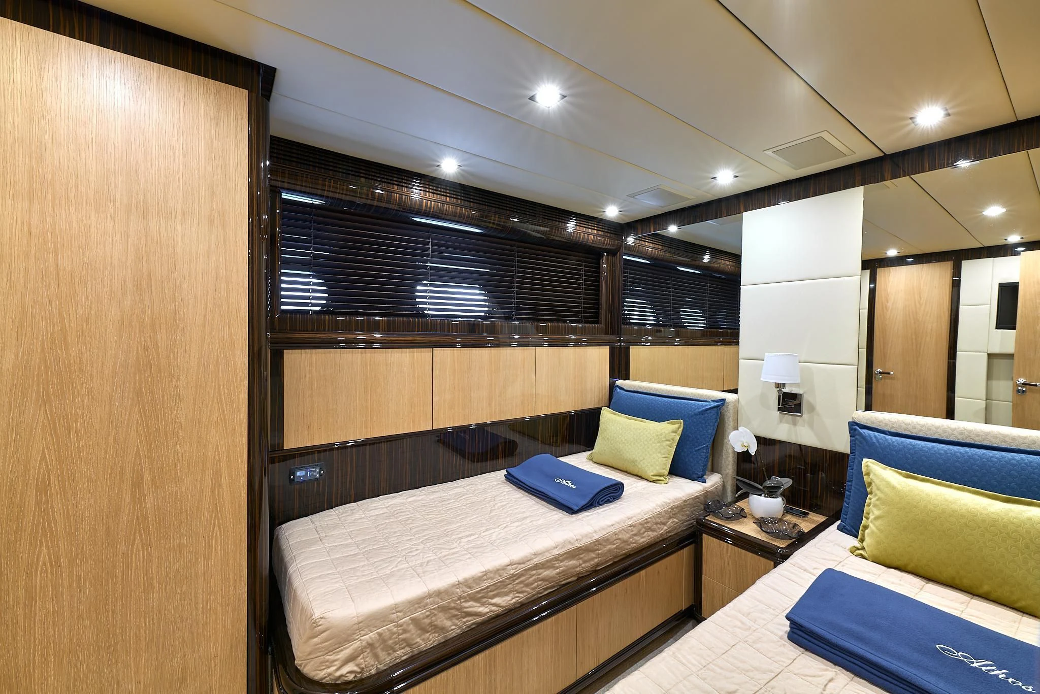 a room with a bed and a desk aboard ATHOS Yacht for Sale