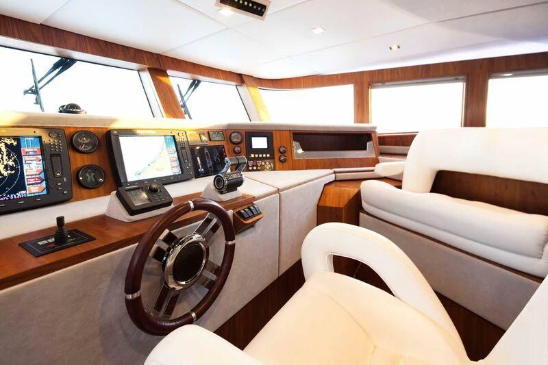 a room with a desk and a couch and a television aboard NASER II Yacht for Sale