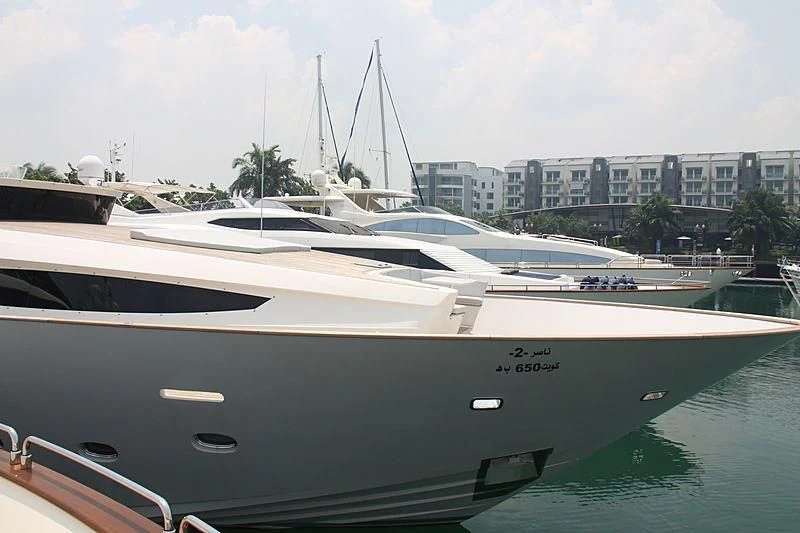 a row of boats in a harbor aboard NASER II Yacht for Sale