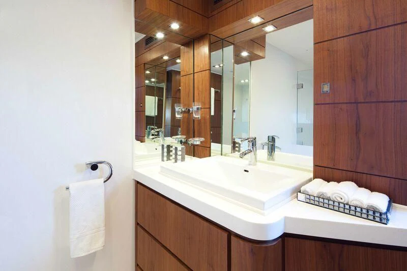 a bathroom with a large mirror aboard NASER II Yacht for Sale
