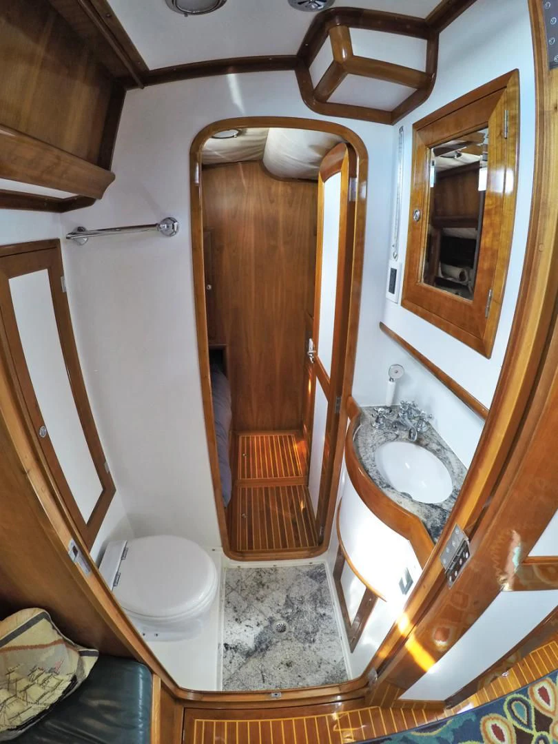 a bathroom with a sink and a toilet aboard WILD THING Yacht for Sale