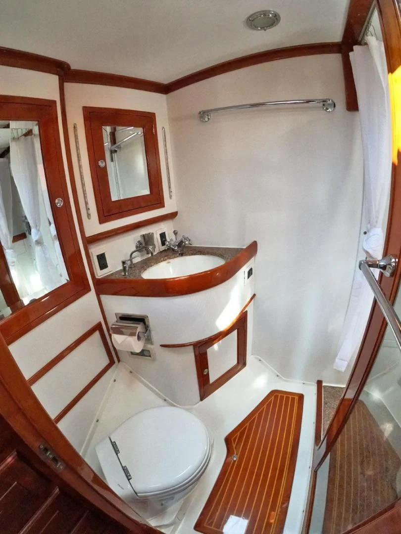 a bathroom with a sink and toilet aboard WILD THING Yacht for Sale