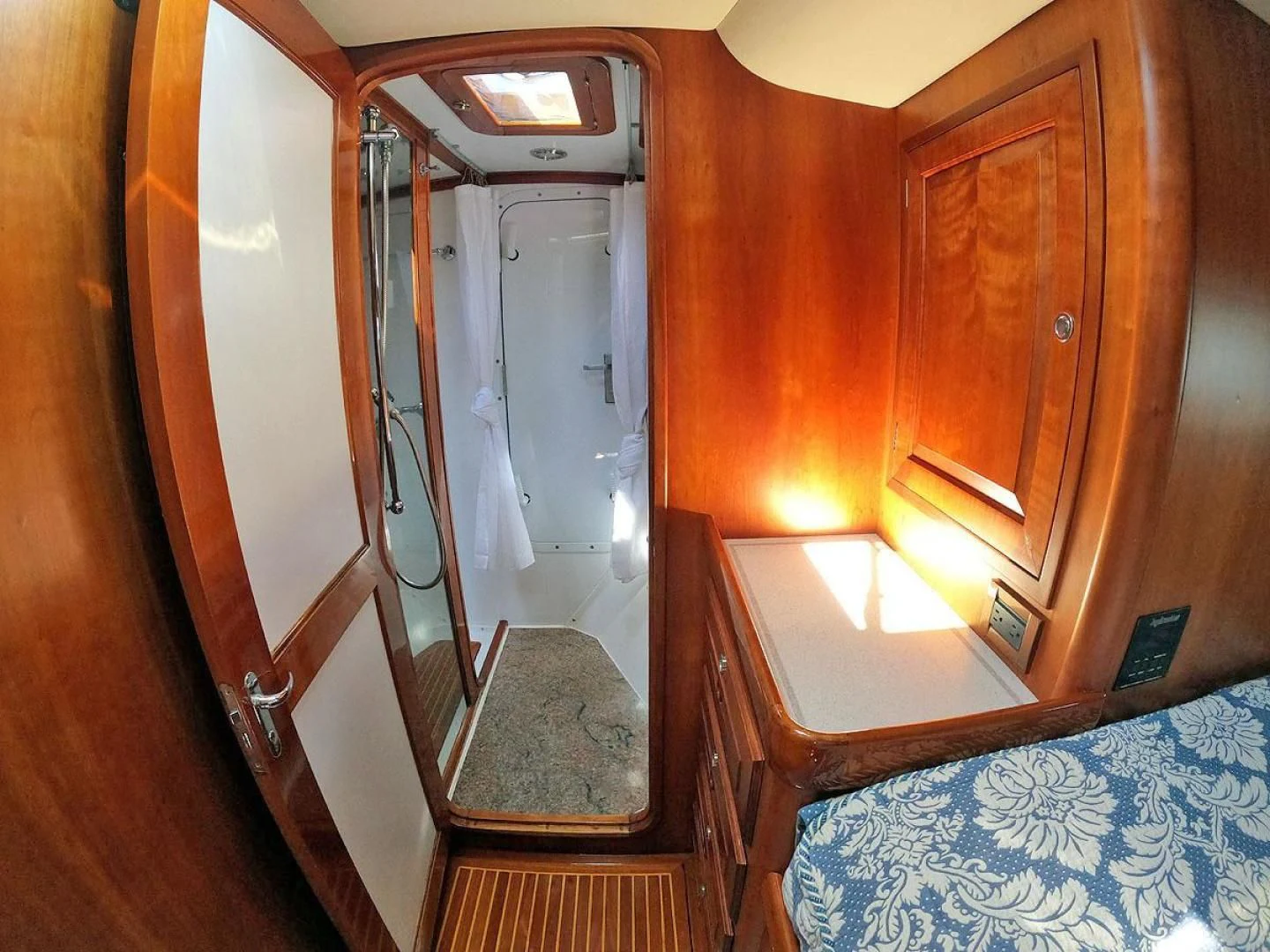 a bathroom with a glass door aboard WILD THING Yacht for Sale