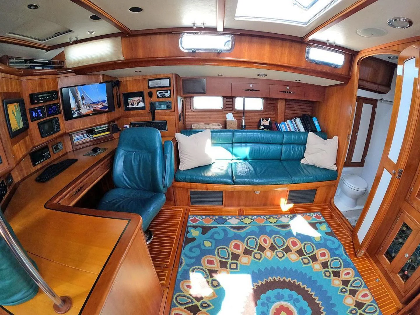a room with a couch and a table aboard WILD THING Yacht for Sale