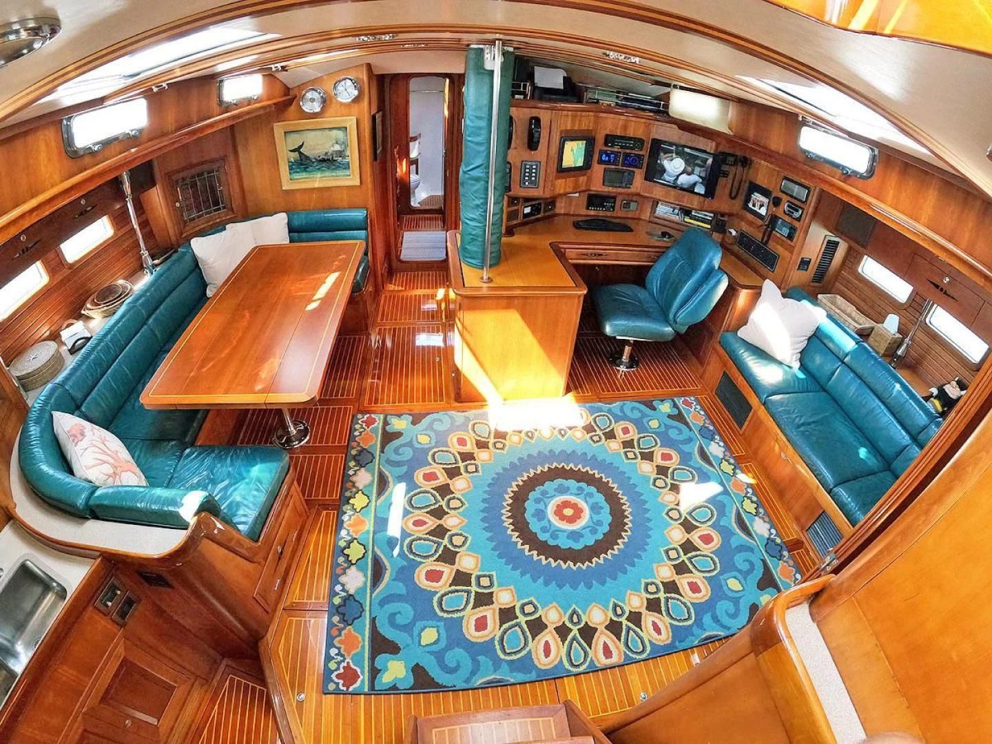 a room with a table and chairs aboard WILD THING Yacht for Sale