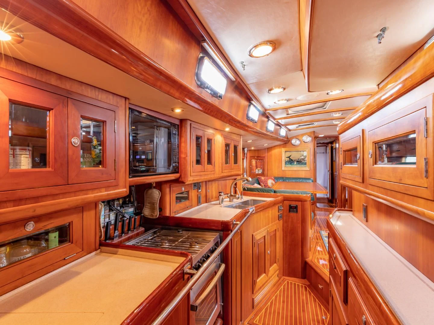 a kitchen with wooden cabinets aboard WILD THING Yacht for Sale
