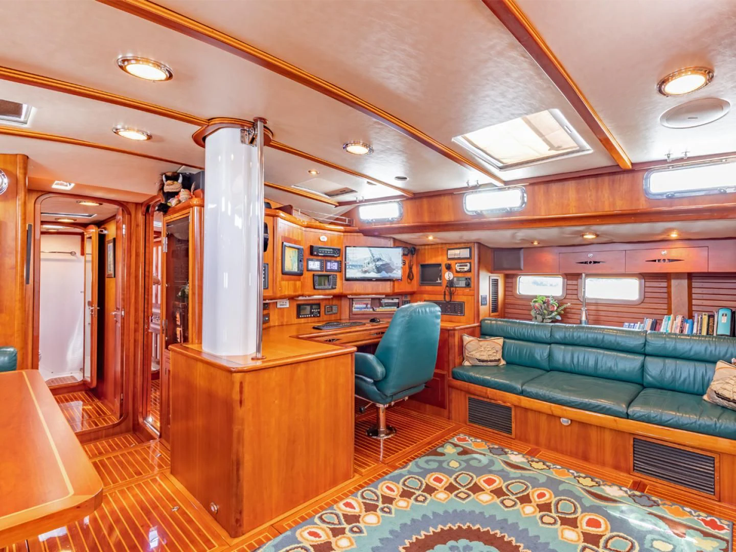a room with a couch and a table aboard WILD THING Yacht for Sale