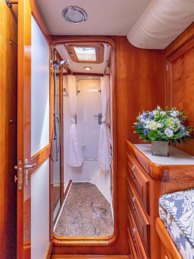 a bathroom with a sink and a mirror aboard WILD THING Yacht for Sale