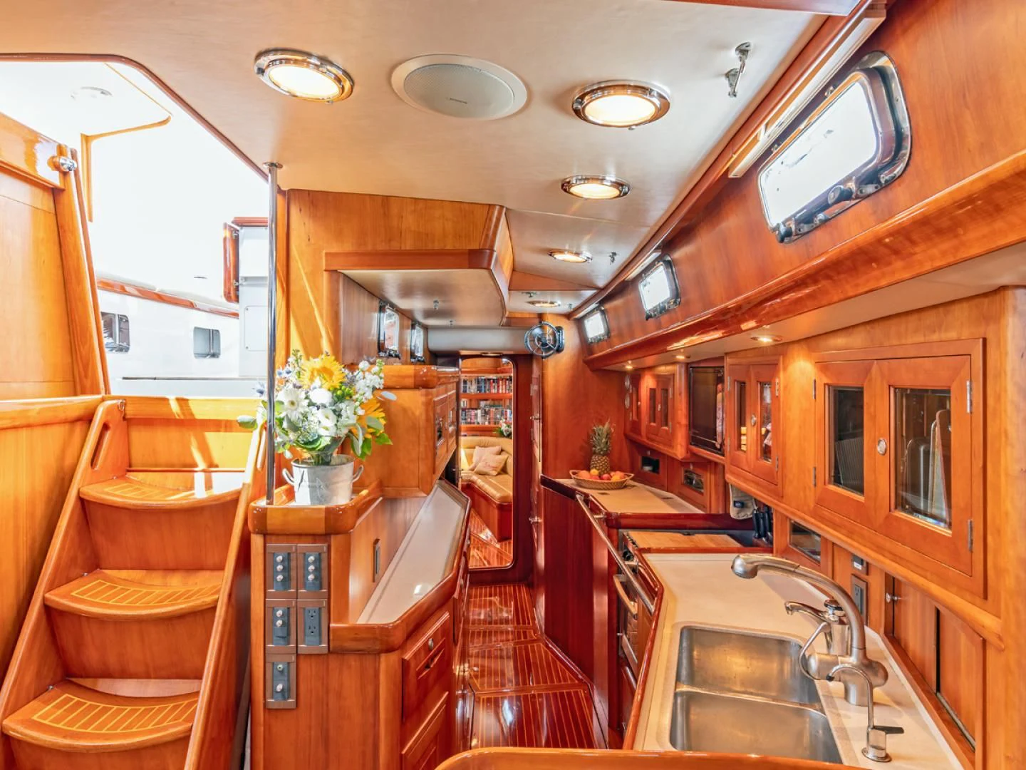 a kitchen with wooden cabinets aboard WILD THING Yacht for Sale
