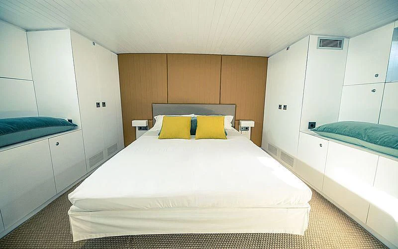 a bed in a room aboard CIUTADELLA Yacht for Sale