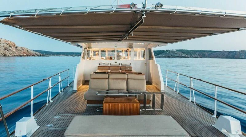 a boat on a water body aboard CIUTADELLA Yacht for Sale