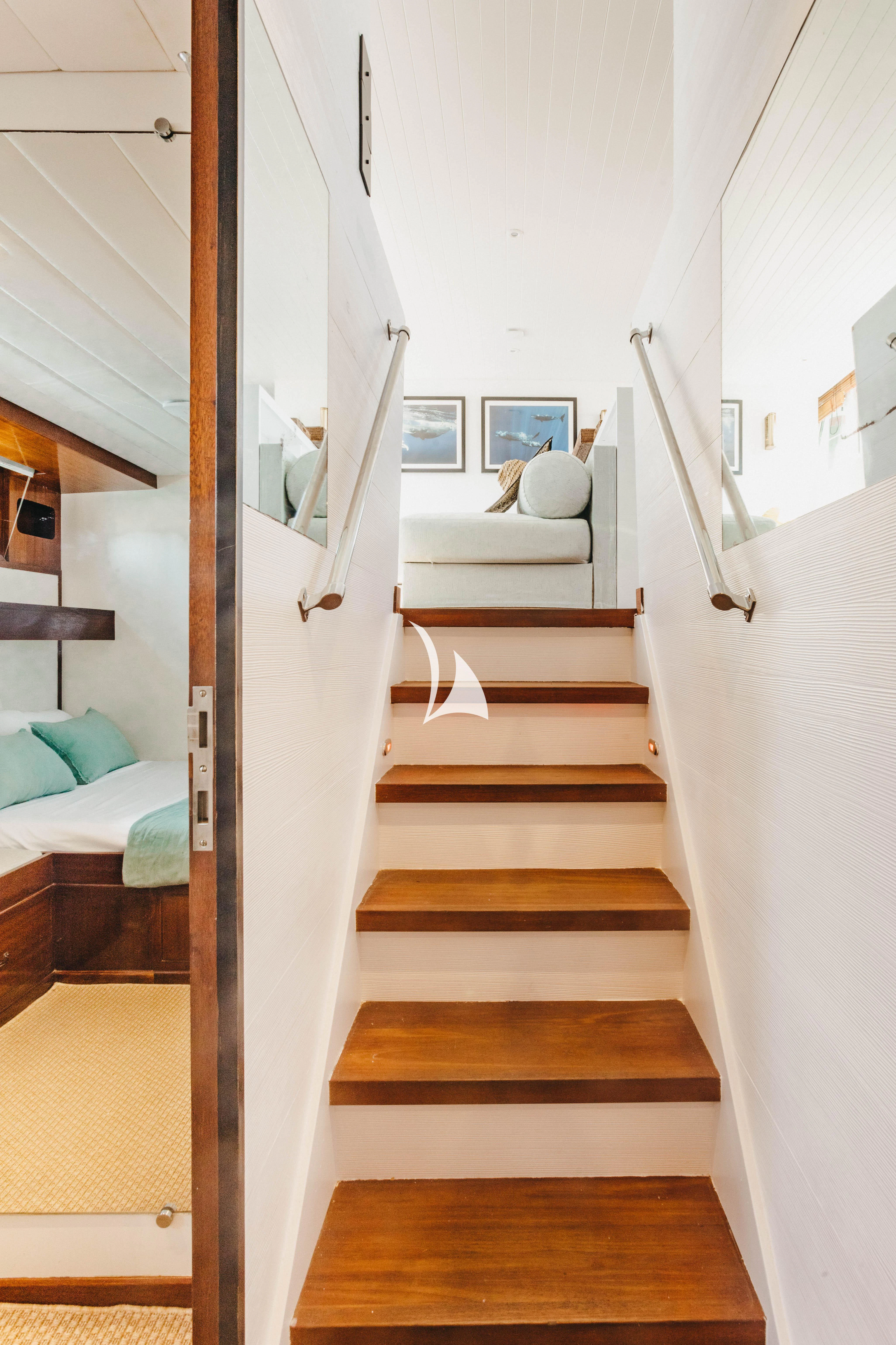 a white staircase in a room aboard CIUTADELLA Yacht for Sale
