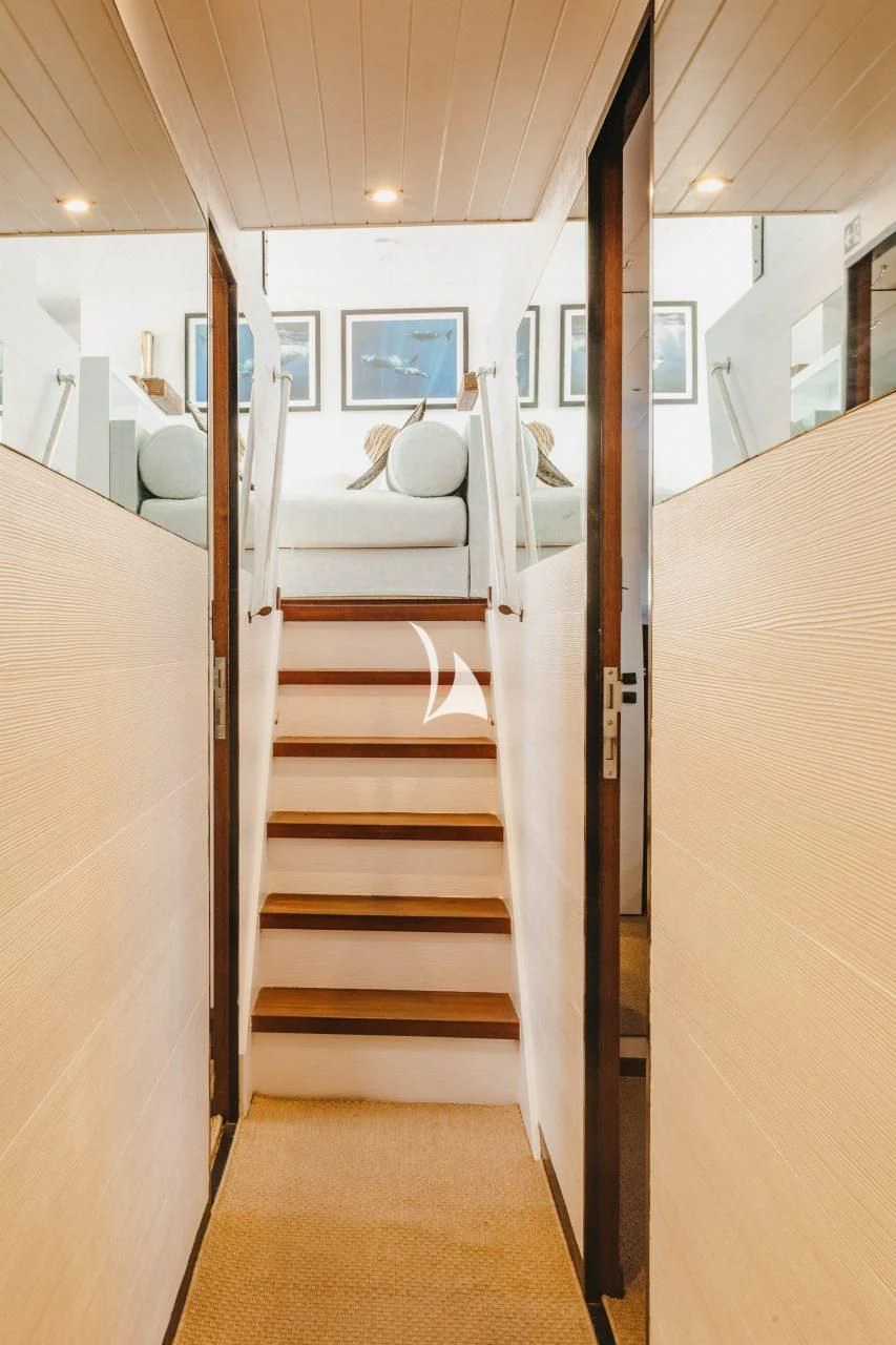 a room with a bed and a mirror aboard CIUTADELLA Yacht for Sale
