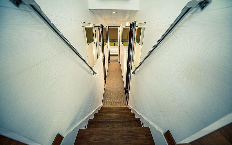 a long hallway with white walls aboard CIUTADELLA Yacht for Sale