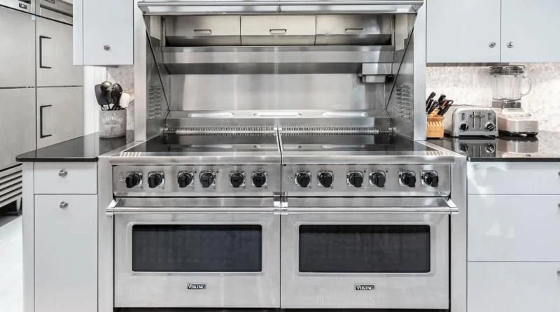 a kitchen with white cabinets aboard SCORPIO Yacht for Sale