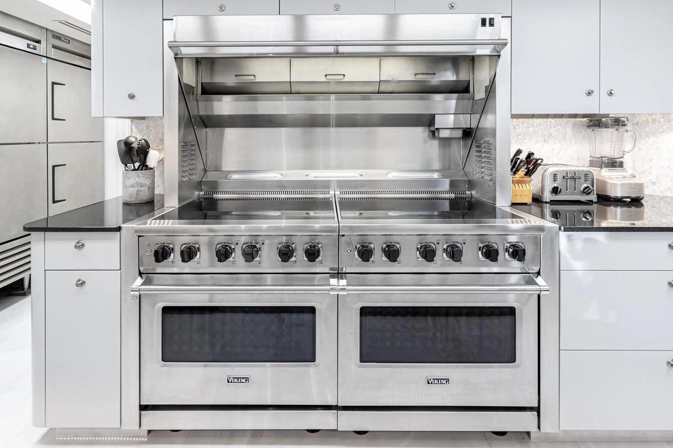 a kitchen with white cabinets aboard SCORPIO Yacht for Sale