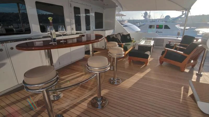 a room with a table and chairs aboard SCORPIO Yacht for Sale